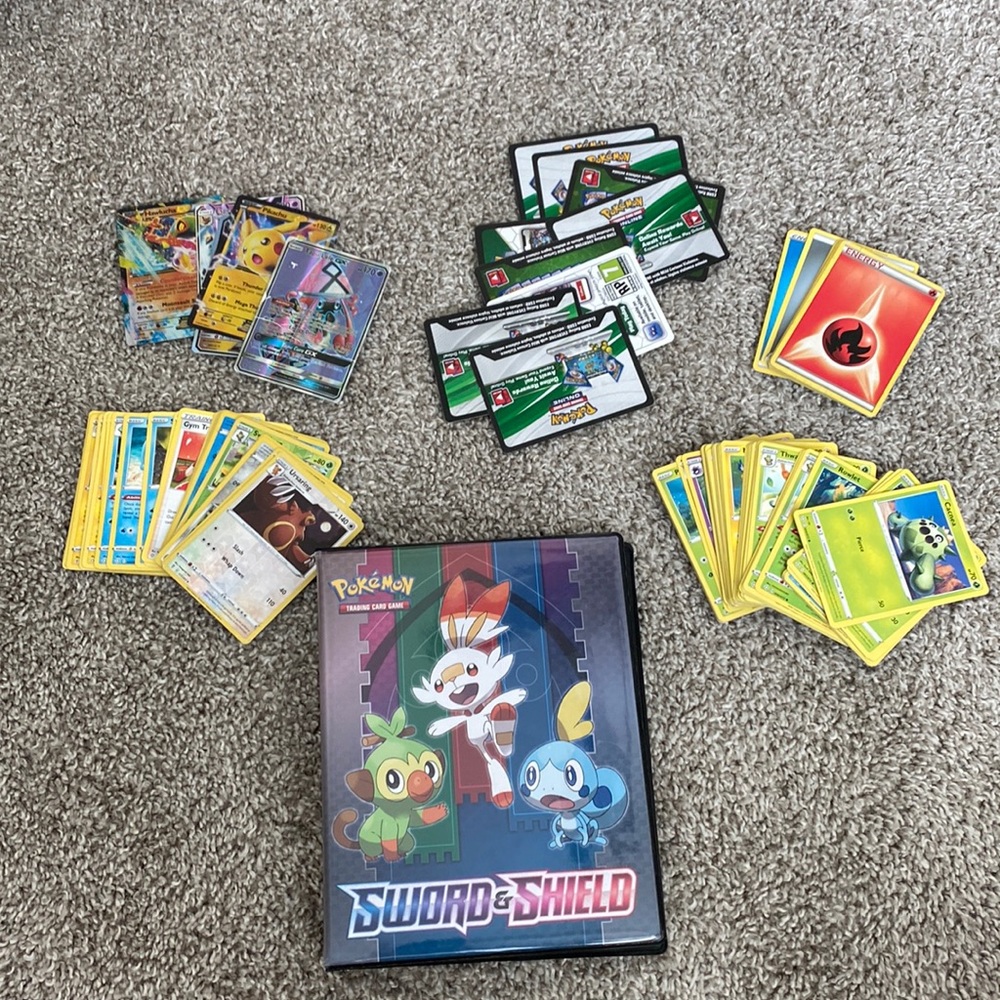 Big lot of Pokemon trading cards with binder